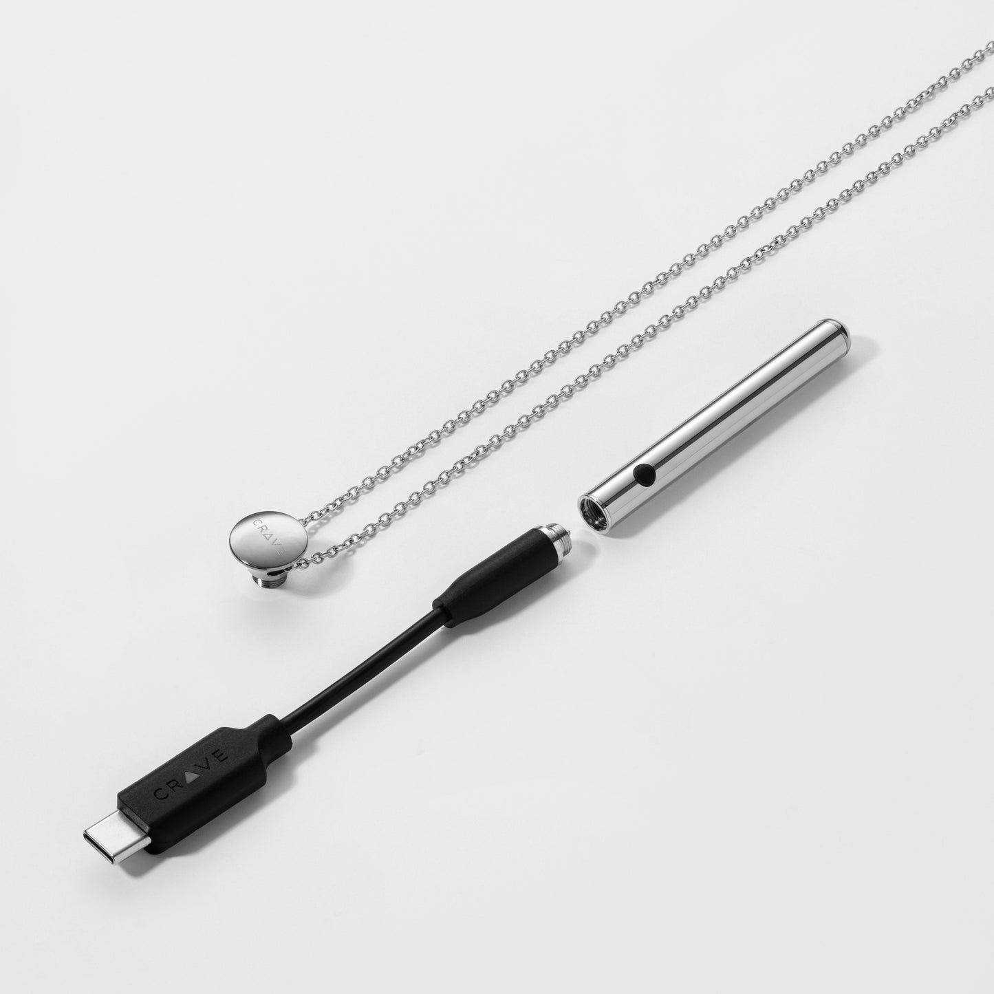 Vesper Mini and its USB-C charger.