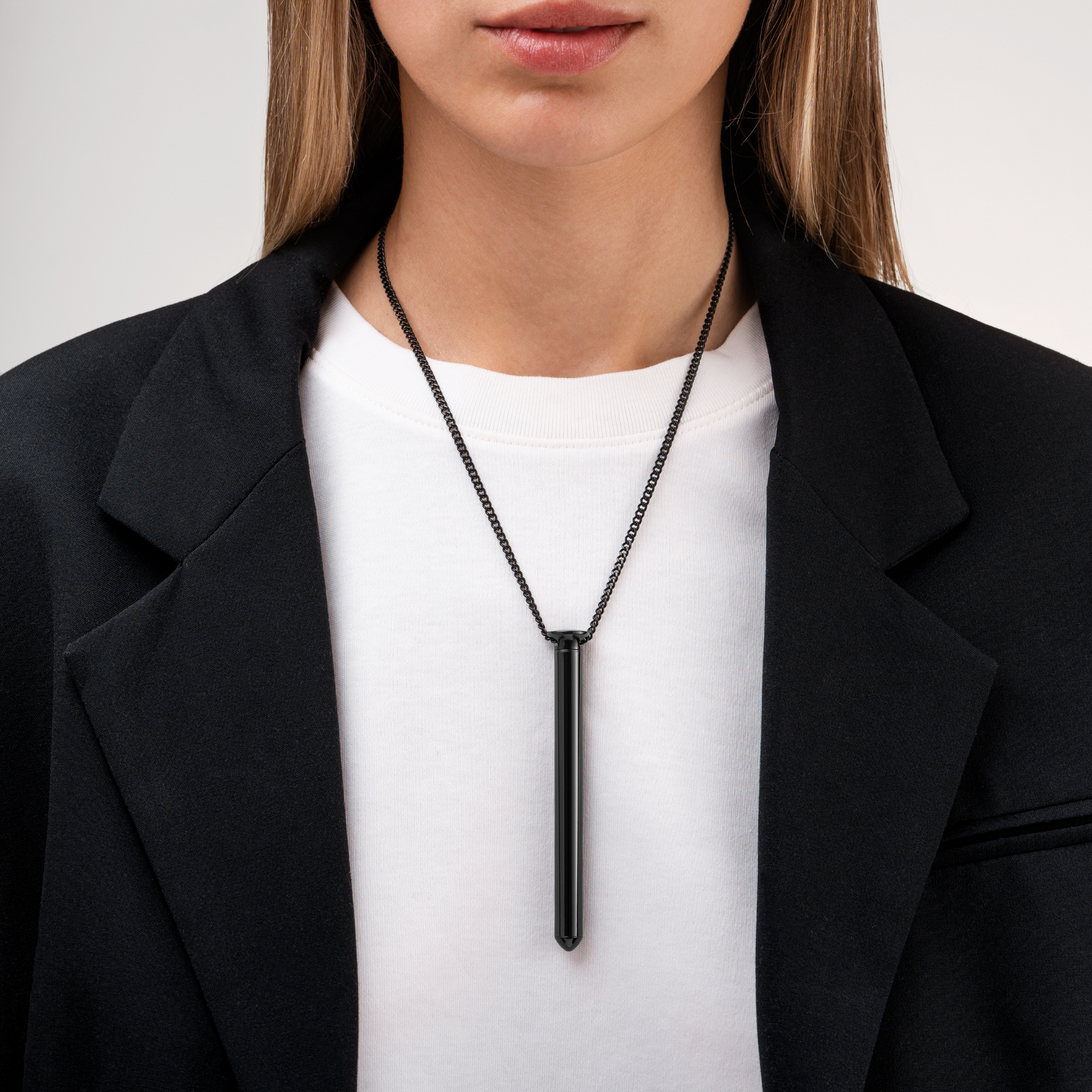Individual wearing the Cuban Chain in black, paired with Vesper 2 in black.