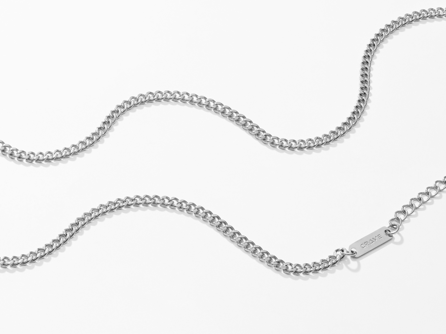 Close-up of cuban chain in silver.
