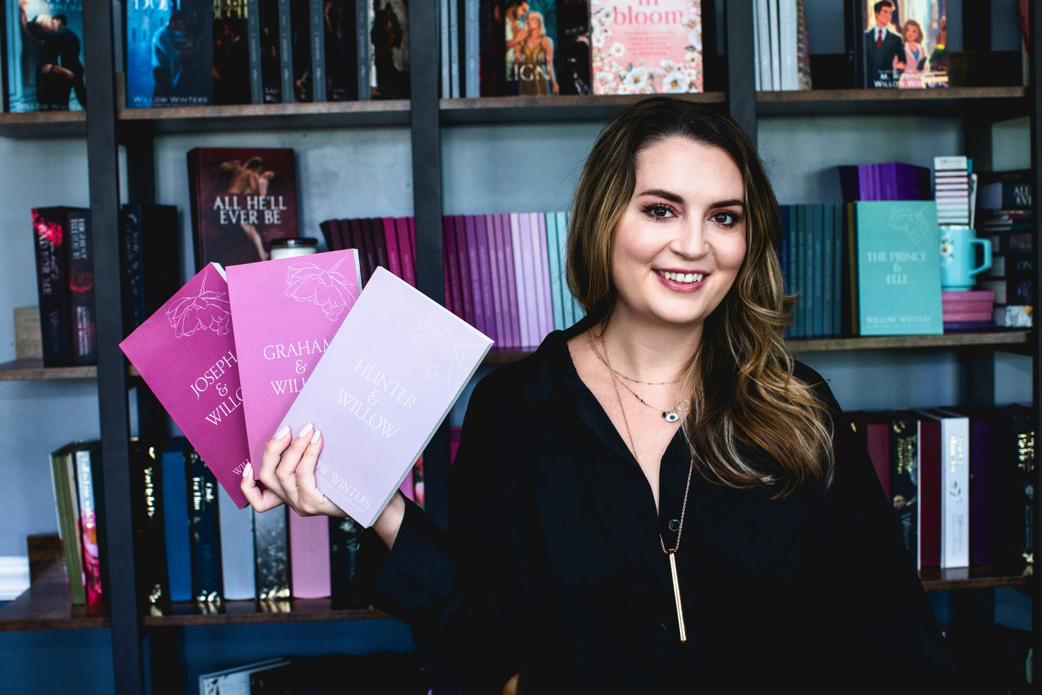 Willow Winters' with her books wearing Vesper.