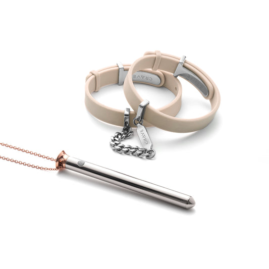ID Cuffs in beige and silver with Vesper in Duotone.