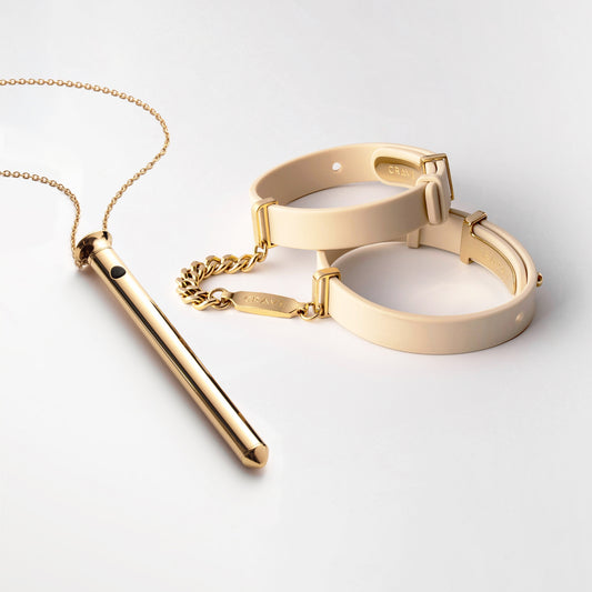 Vesper 2 in 24kt gold with ID Cuffs in beige and 24kt gold.